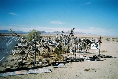 fence with many shoes attached to it