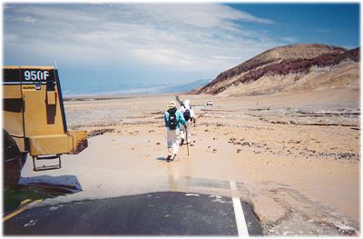 Ron and Dinesh crossing the flooded roadway